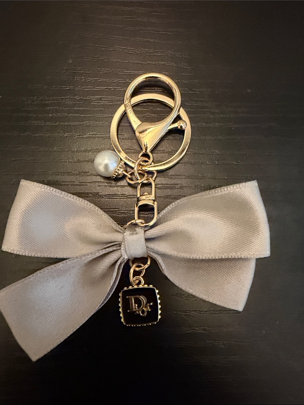 Inspired Gold-Tone Keychain Charm with Gray Satin Bow and Pearl Accent